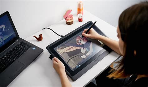 Schéma de connexion d'une tablette graphique Wacom Cintiq avec câbles USB et vidéo connectés directement à l'ordinateur.