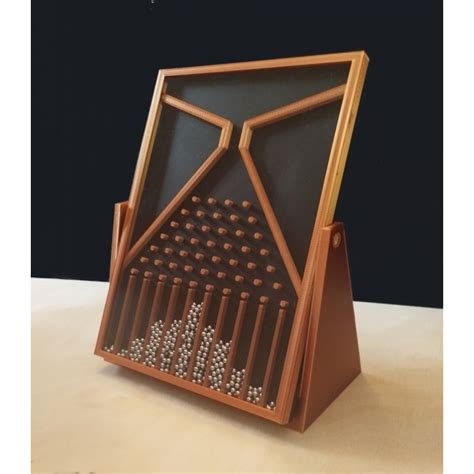 Schéma de la planche de Galton avec des trajectoires possibles pour une boule