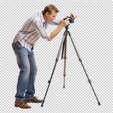 Photographe utilisant un trépied pour prendre une série de photos destinées à la création d'un panorama.