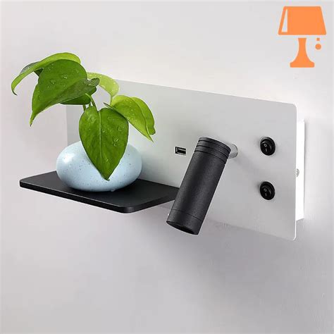 Lampe applique liseuse murale avec tablette intégrée dans une chambre