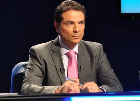 Photo de Claudiu Lucaci en tenue formelle, potentiellement lors d'un événement officiel.