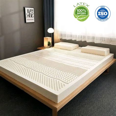 Coupe transversale d'un matelas en latex naturel, montrant sa structure.